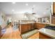 Well-equipped kitchen featuring stainless steel appliances, wooden cabinets, and an open layout at 1794 Bell Rd, Morgantown, IN 46160