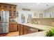 The kitchen boasts wood cabinetry, stone countertops, and stainless steel appliances at 1794 Bell Rd, Morgantown, IN 46160