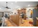 Open kitchen design with wooden cabinets, stainless appliances, and an open layout to the breakfast nook at 1794 Bell Rd, Morgantown, IN 46160