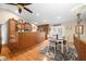 Modern kitchen features hardwood floors, a breakfast bar, stainless steel appliances, and an adjacent dining area at 1794 Bell Rd, Morgantown, IN 46160