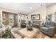 Bright living room with a decorative front door, large windows, and an open floor plan at 1794 Bell Rd, Morgantown, IN 46160