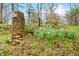 Rustic stone mailbox with daffodils and natural landscaping adds curb appeal at 1794 Bell Rd, Morgantown, IN 46160