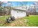 An exterior shot of the white storage shed at 1794 Bell Rd, Morgantown, IN 46160