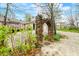 A unique stone archway in the yard adds character to the home's exterior at 1794 Bell Rd, Morgantown, IN 46160