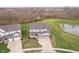 Charming two-story home with a well-manicured lawn, pond, and attached two-car garage at 19477 Quilling Ln, Noblesville, IN 46062