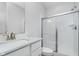 Bathroom with white subway tile shower and glass door, quartz countertop vanity, and brushed nickel faucet at 19477 Quilling Ln, Noblesville, IN 46062