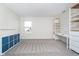 Bright bonus room with carpet floors, natural light, storage shelving and desk at 19477 Quilling Ln, Noblesville, IN 46062