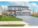 Charming two-story home with a well-manicured lawn and a welcoming front porch at 19477 Quilling Ln, Noblesville, IN 46062