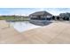 Community swimming pool with a covered cabana, lounge chairs, and a clear reflection of the roof at 19477 Quilling Ln, Noblesville, IN 46062