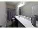 Bathroom featuring a spacious vanity with grey cabinets and a large mirror at 20881 Hamilton-Boone County Line Rd, Sheridan, IN 46069