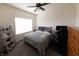 Cozy bedroom with a neutral color scheme, a comfortable bed and natural light from the window at 20881 Hamilton-Boone County Line Rd, Sheridan, IN 46069