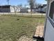 Large, grassy backyard enclosed with fencing, perfect for outdoor activities with fire pit for relaxation at 2105 N Cherry St, Columbus, IN 47201