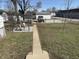 Spacious backyard features well-maintained lawn, charming patio, and a classic Jeep adding character to outdoor living at 2105 N Cherry St, Columbus, IN 47201
