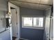 Efficient mudroom with hand sanitizer dispenser, convenient for transitional space between indoors and outdoors at 2105 N Cherry St, Columbus, IN 47201