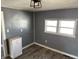 Versatile room featuring ample natural light, neutral walls, and modern floors, perfect for customized living at 2105 N Cherry St, Columbus, IN 47201
