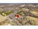 An aerial view of the property shows it surrounded by trees and nearby homes in the neighborhood at 2305 Bill Smith Rd, Martinsville, IN 46151