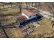 Aerial view showcases the home's backyard, garden area, and surrounding natural landscape at 2305 Bill Smith Rd, Martinsville, IN 46151