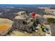 An aerial view shows the property surrounded by trees and lush greenery during the day at 2305 Bill Smith Rd, Martinsville, IN 46151