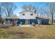 Expansive backyard with patio, mature trees, and outdoor seating, perfect for entertaining and relaxation at 2305 Bill Smith Rd, Martinsville, IN 46151