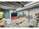 Finished basement with large sofas, television, games and decor, perfect for entertainment at 2305 Bill Smith Rd, Martinsville, IN 46151