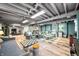 Basement recreational area with multiple seating areas, a TV, workout equipment, and a game table at 2305 Bill Smith Rd, Martinsville, IN 46151
