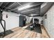 Finished basement area showcasing a gym, workout equipment, a sauna, and attractive wood-look flooring at 2305 Bill Smith Rd, Martinsville, IN 46151