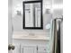Bright bathroom featuring a white vanity, framed mirror, and modern sconces at 2305 Bill Smith Rd, Martinsville, IN 46151