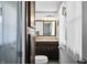 View of bathroom with toilet, and brown vanity with granite top and wood trimmed mirror at 2305 Bill Smith Rd, Martinsville, IN 46151