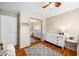 A naturally lit bedroom featuring an area rug, a large dresser, and a mirror closet at 2305 Bill Smith Rd, Martinsville, IN 46151