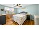 Naturally lit bedroom featuring stylish decor, wood floors, and a lovely bed set at 2305 Bill Smith Rd, Martinsville, IN 46151