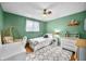 Bright bedroom featuring white furniture, a ceiling fan, and a plush area rug on top of neutral carpet at 2305 Bill Smith Rd, Martinsville, IN 46151