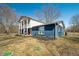 Exterior view of home with a large yard, mature trees, and charming curb appeal at 2305 Bill Smith Rd, Martinsville, IN 46151