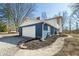 Home exterior with attached garage, well-maintained landscaping, and attractive curb appeal at 2305 Bill Smith Rd, Martinsville, IN 46151