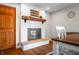Dining area features a charming white fireplace with wood mantle and rustic accents at 2305 Bill Smith Rd, Martinsville, IN 46151