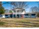 Charming two-story home with a spacious front yard, red front door and a welcoming porch at 2305 Bill Smith Rd, Martinsville, IN 46151