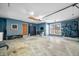 Spacious garage featuring blue painted walls, storage cabinets, hanging bike racks, and lots of storage space at 2305 Bill Smith Rd, Martinsville, IN 46151