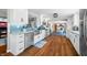 Updated kitchen with stainless steel appliances, a farmhouse sink, and a charming blue backsplash at 2305 Bill Smith Rd, Martinsville, IN 46151