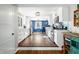 Modern kitchen featuring white cabinets, stainless steel appliances, and stylish blue backsplash at 2305 Bill Smith Rd, Martinsville, IN 46151