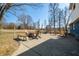 Wide angle view of an open patio with a fire pit surrounded by chairs, great for outdoor gatherings at 2305 Bill Smith Rd, Martinsville, IN 46151