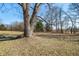 Spacious yard features a tree with a swing adding charm to the natural landscape at 2305 Bill Smith Rd, Martinsville, IN 46151