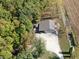 Aerial view of a large outbuilding surrounded by lush greenery and adjacent to open farmland at 2387 Bill Smith Rd, Martinsville, IN 46151