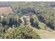 This aerial shot offers a fantastic perspective of the entire property, with a beautiful pond at 2387 Bill Smith Rd, Martinsville, IN 46151