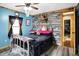 Bright bedroom featuring a vintage bed frame, hardwood accents, and a cozy feel at 2387 Bill Smith Rd, Martinsville, IN 46151