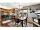 Eat-in dining area featuring a wood table, wood floors, and lots of natural light at 2387 Bill Smith Rd, Martinsville, IN 46151