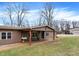 Exterior view of home with an inviting porch and well-maintained lawn and outbuilding in background at 2387 Bill Smith Rd, Martinsville, IN 46151