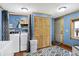 Functional laundry room features modern washer and dryer, wood cabinets and lots of space at 2387 Bill Smith Rd, Martinsville, IN 46151