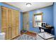 Bright laundry room with wooden cabinets, a window, and space for laundry organization at 2387 Bill Smith Rd, Martinsville, IN 46151