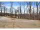 View of a pond surrounded by trees, showcasing the property's peaceful setting at 2387 Bill Smith Rd, Martinsville, IN 46151