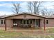 Home exterior showcasing a spacious covered porch, perfect for relaxing outdoors at 2387 Bill Smith Rd, Martinsville, IN 46151