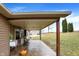 Home exterior featuring a covered porch and well-maintained lawn, ideal for outdoor enjoyment at 2387 Bill Smith Rd, Martinsville, IN 46151